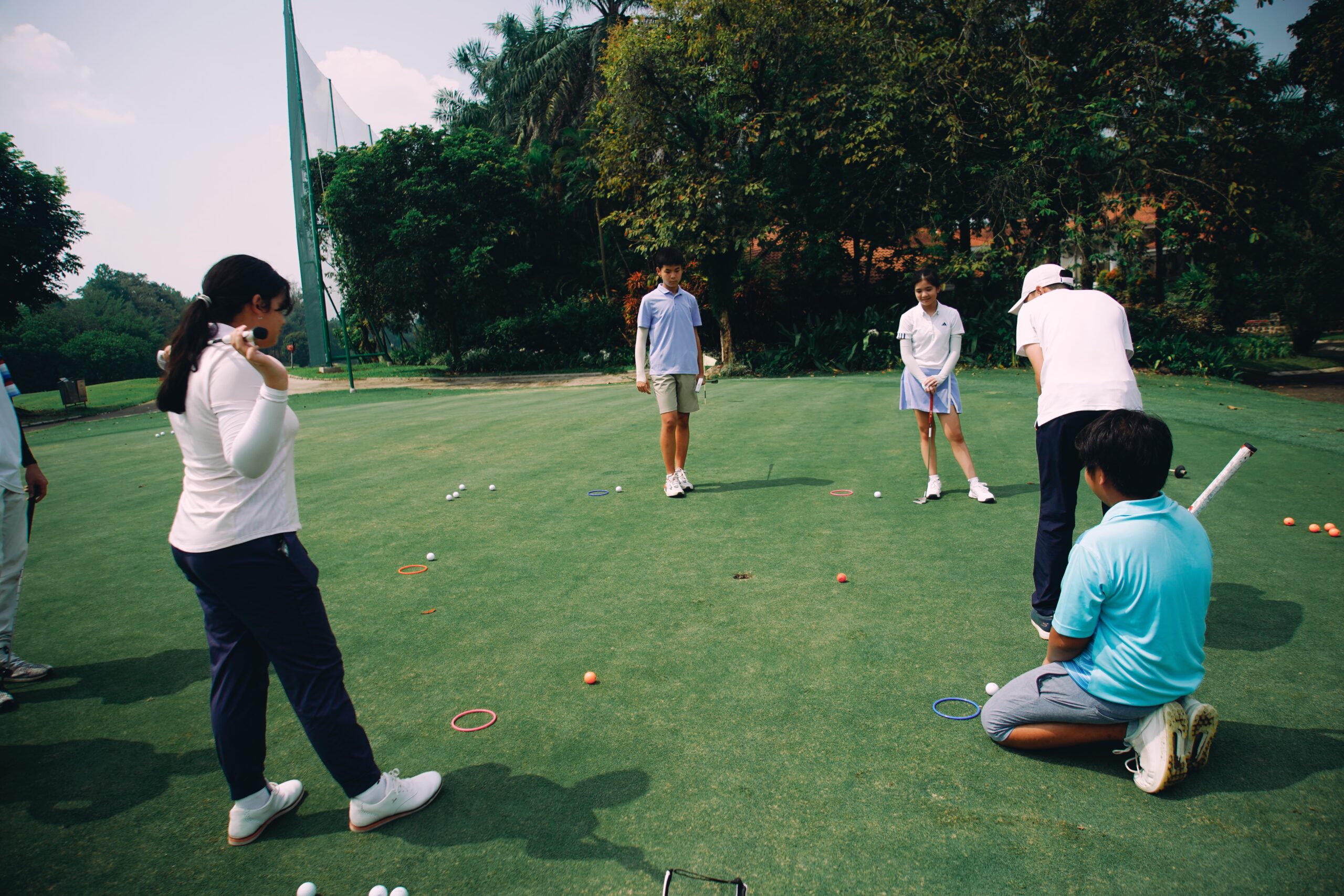 driving range situation during summer golf camp 2025